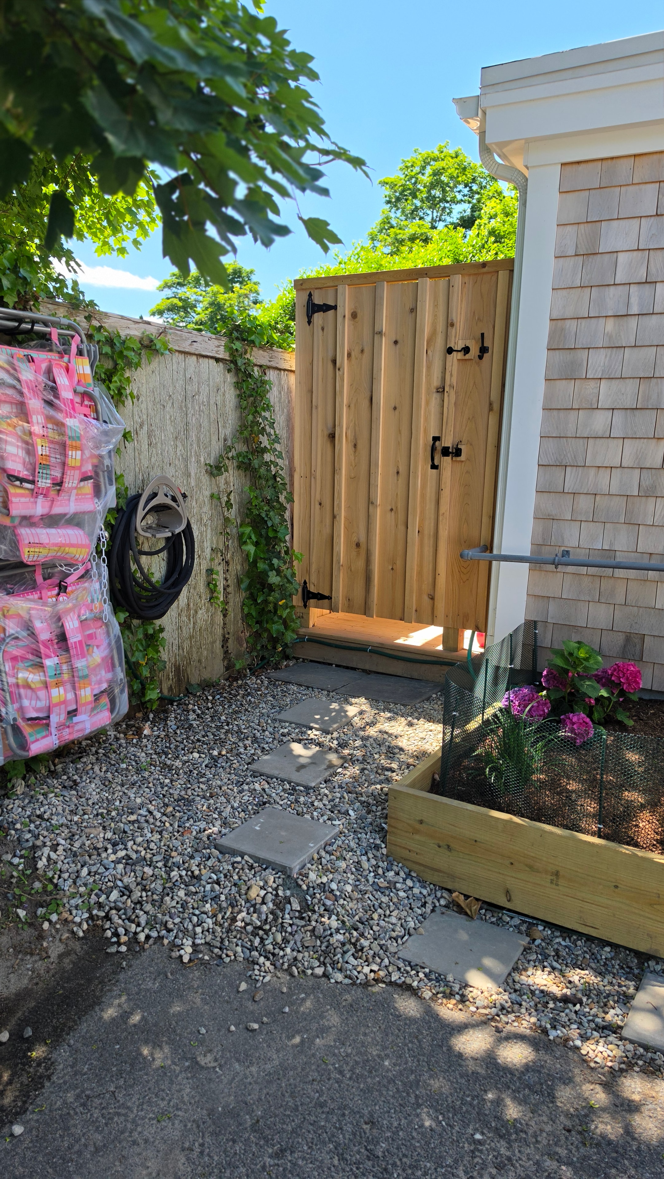 Cape Coddage outdoor shower with cedar shingles and ivy