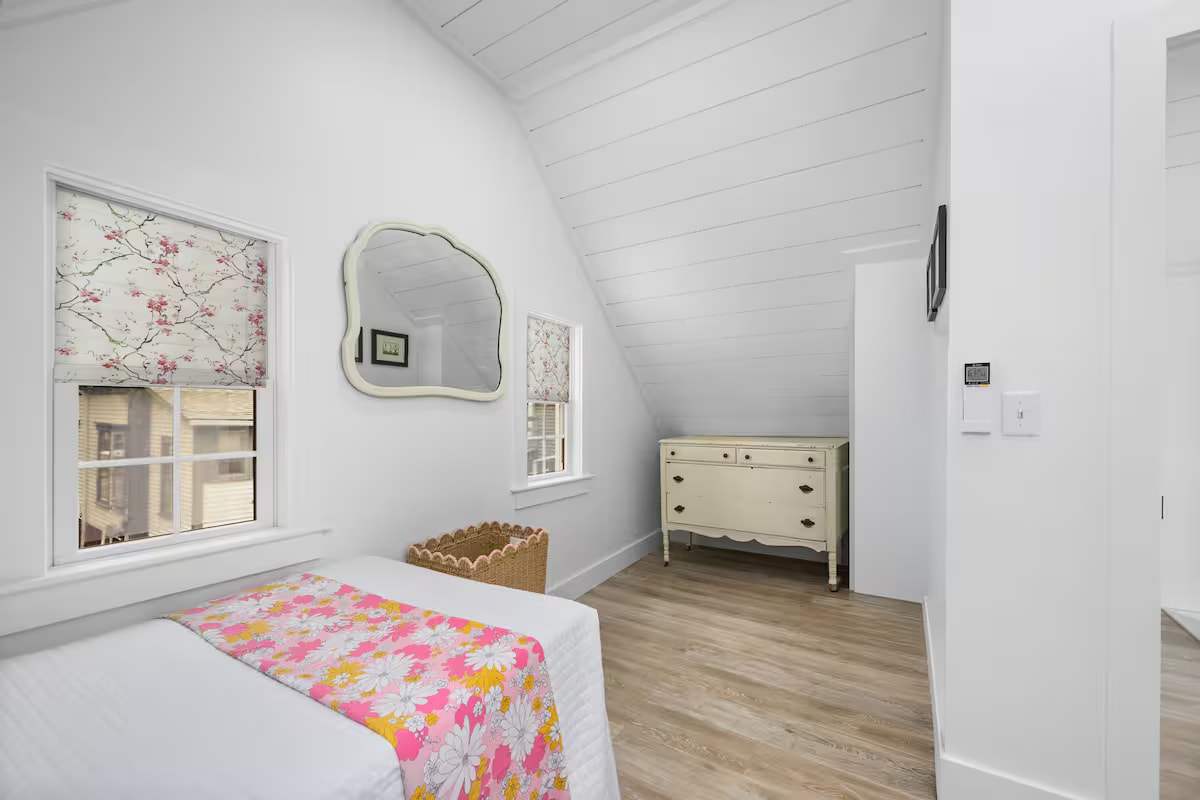 Cape Coddage twin bedroom with dresser and mirror